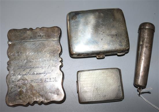 A silver card case, a silver cigarette case, a silver match sleeve and a silver cased amber cigar holder.